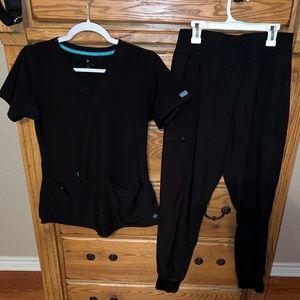 Med Couture scrub set top is XS bottom is S in black